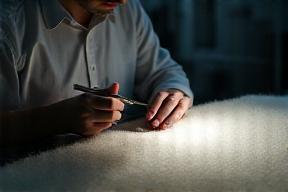Technician controlling fabric quality standards